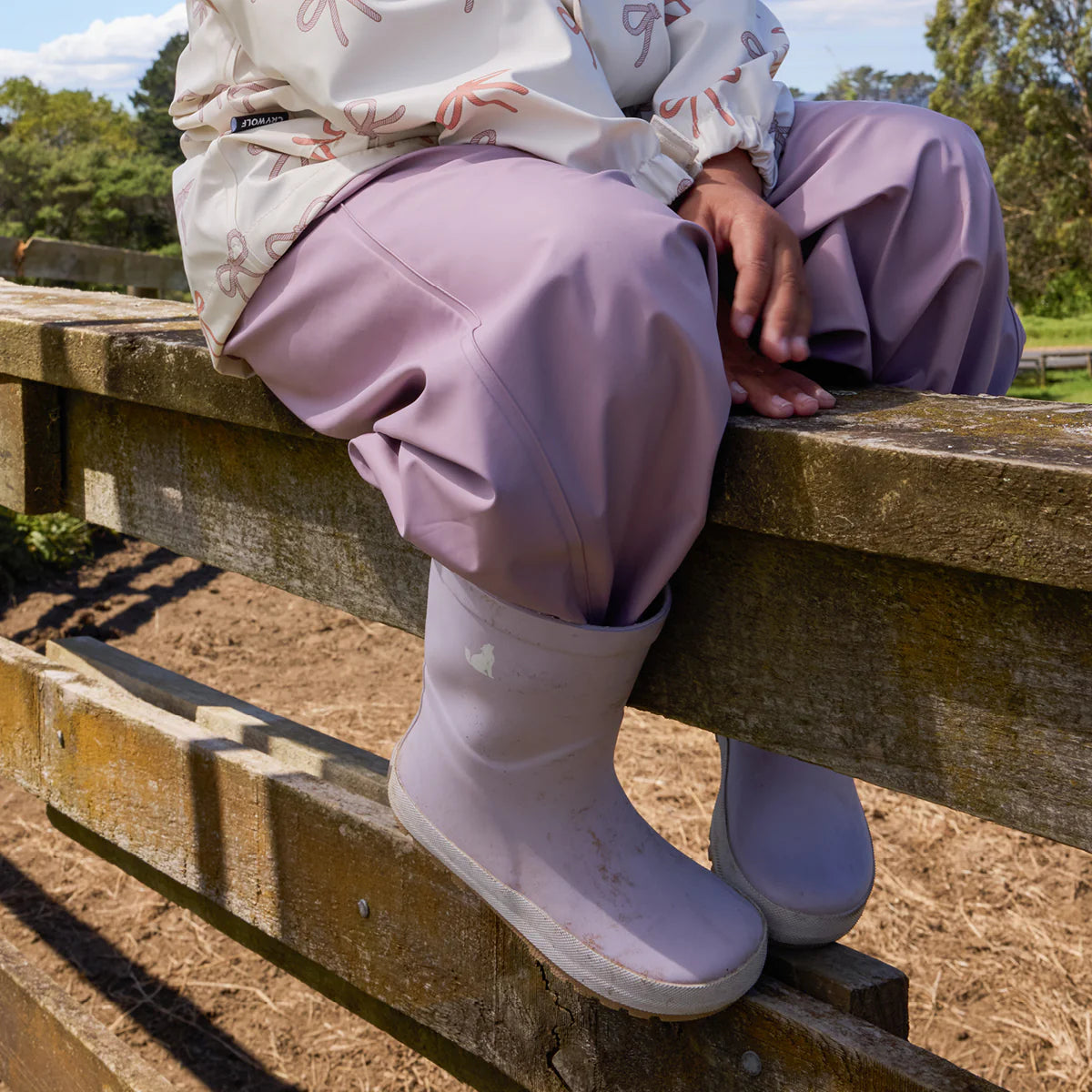 Child wearing Crywolf Rain Boots Heather outdoors