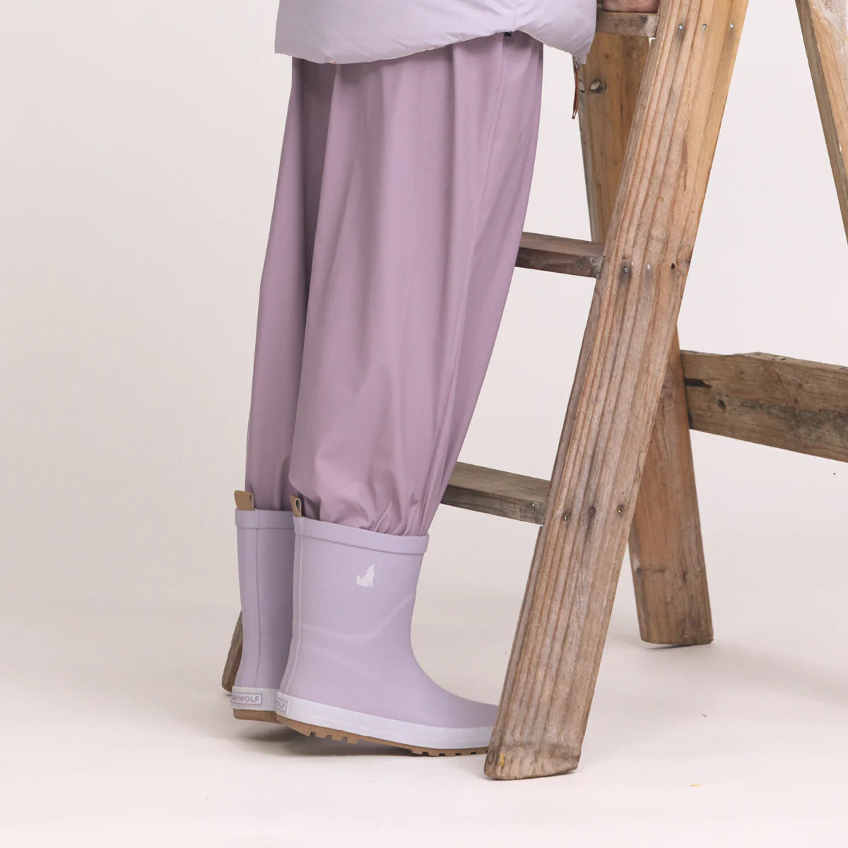 Child wearing Crywolf Rain Boots Heather outdoors