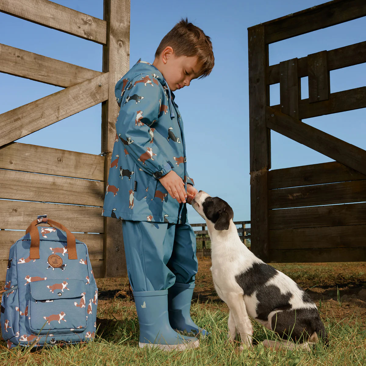Child wearing Crywolf Rain Boots Highland Blue outdoors