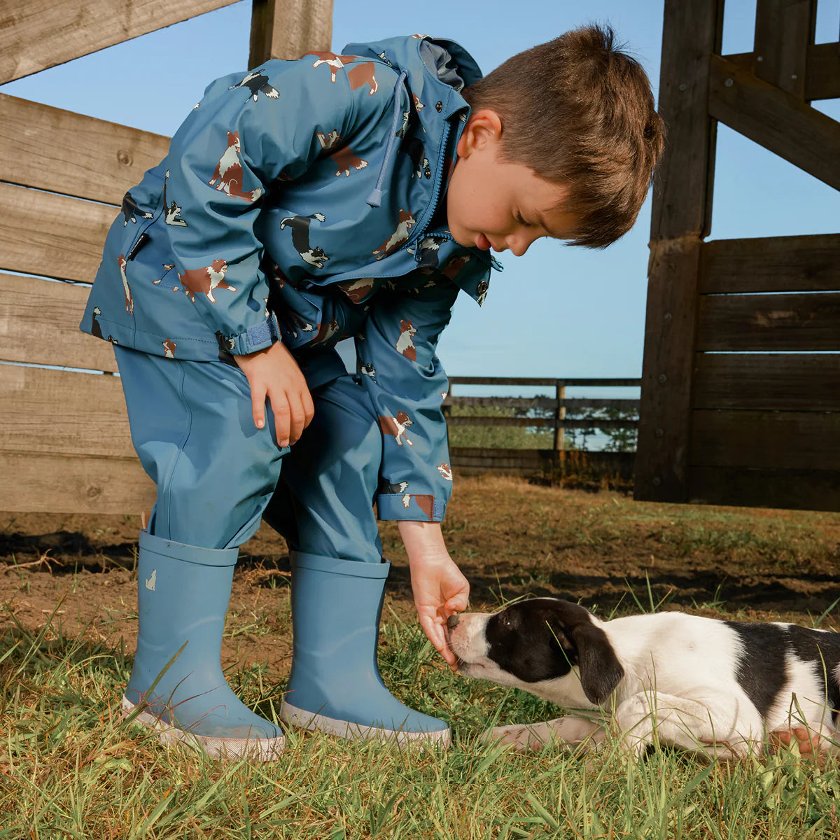 Child wearing Crywolf Rain Boots Highland Blue outdoors