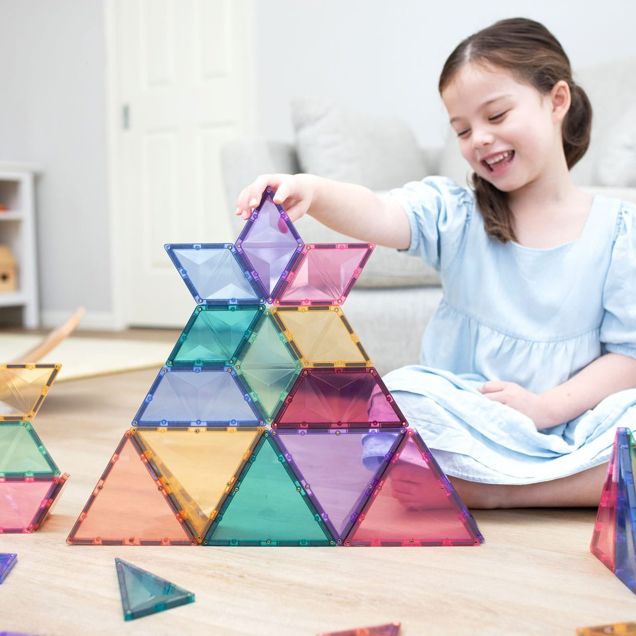 Children building creative 3D structures using Connetix Pastel Shape Expansion Pack