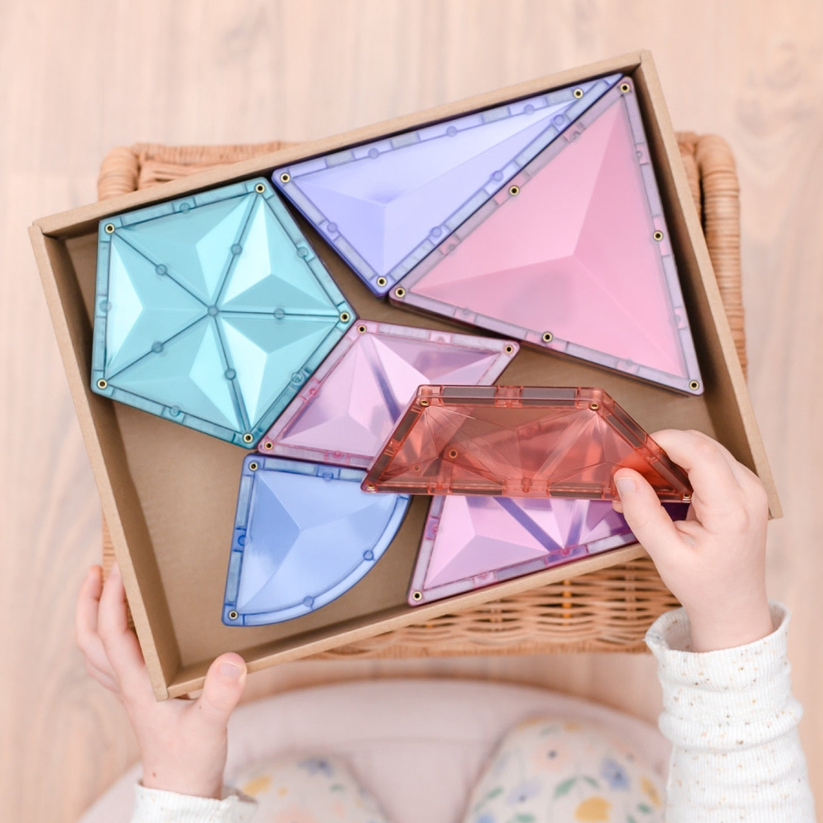 Children building creative 3D structures using Connetix Pastel Shape Expansion Pack