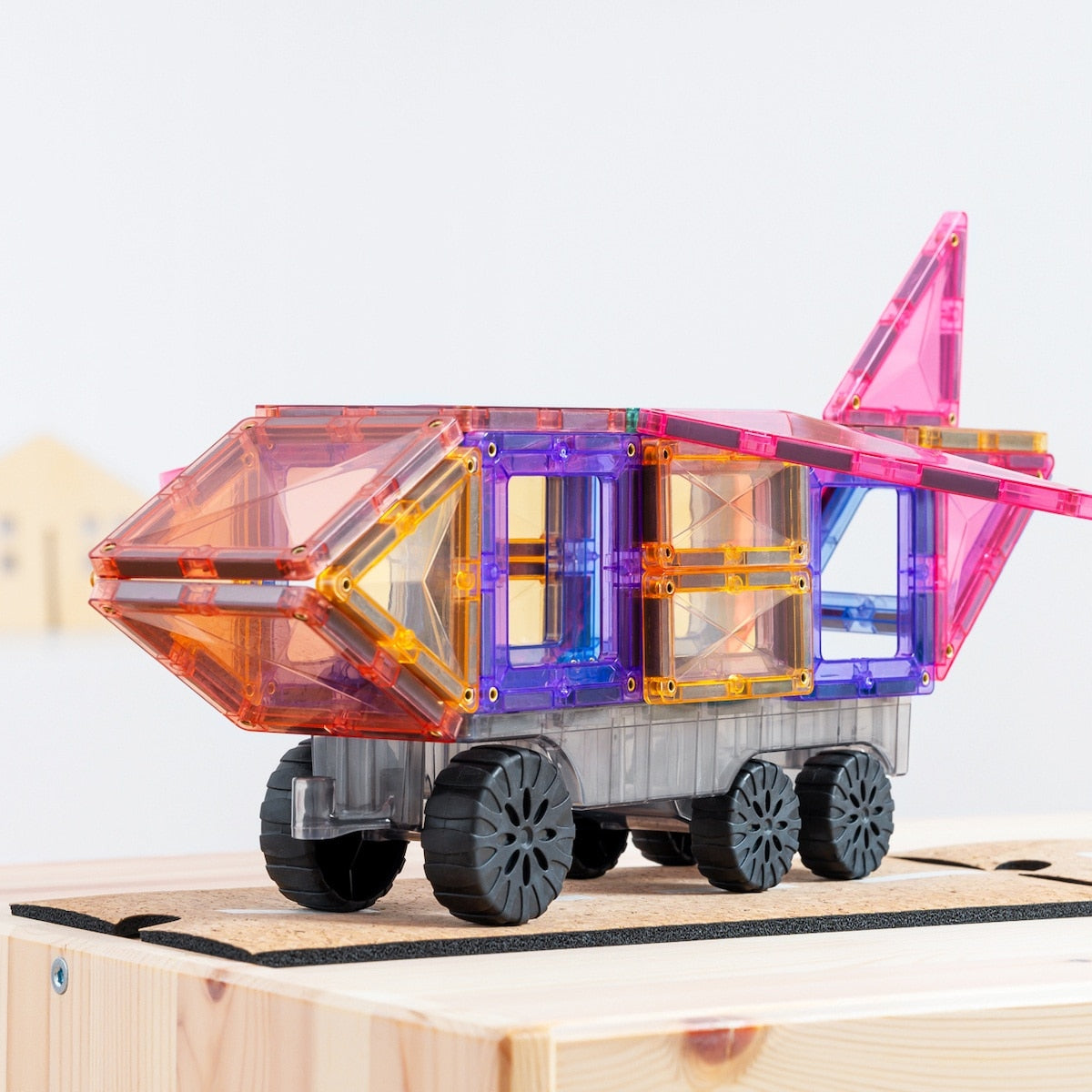 Children playing with Connetix Pastel Transport Pack – magnetic car and train pieces in action"