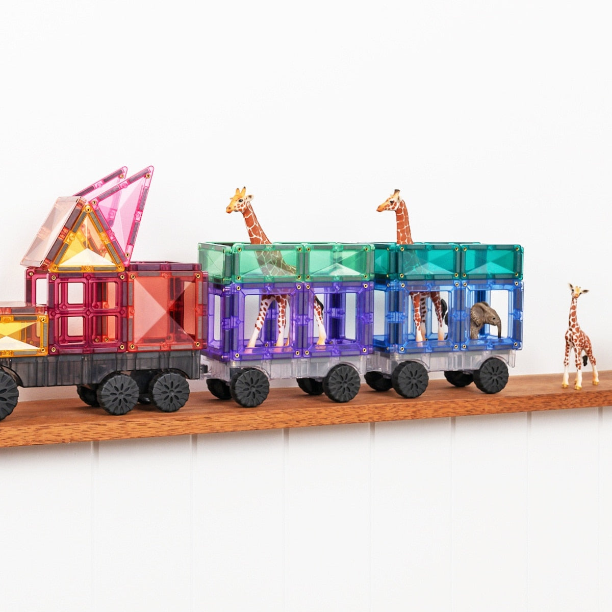 Close-up of pastel-coloured magnetic tiles and vehicle bases from Connetix Transport Pack