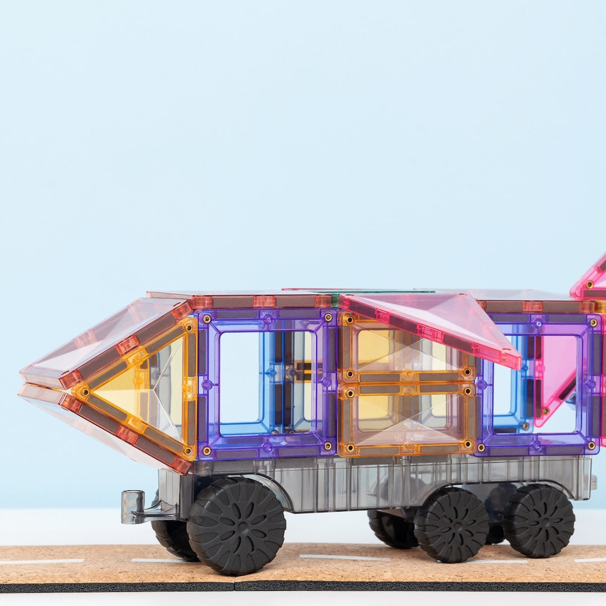 Close-up of pastel-coloured magnetic tiles and vehicle bases from Connetix Transport Pack