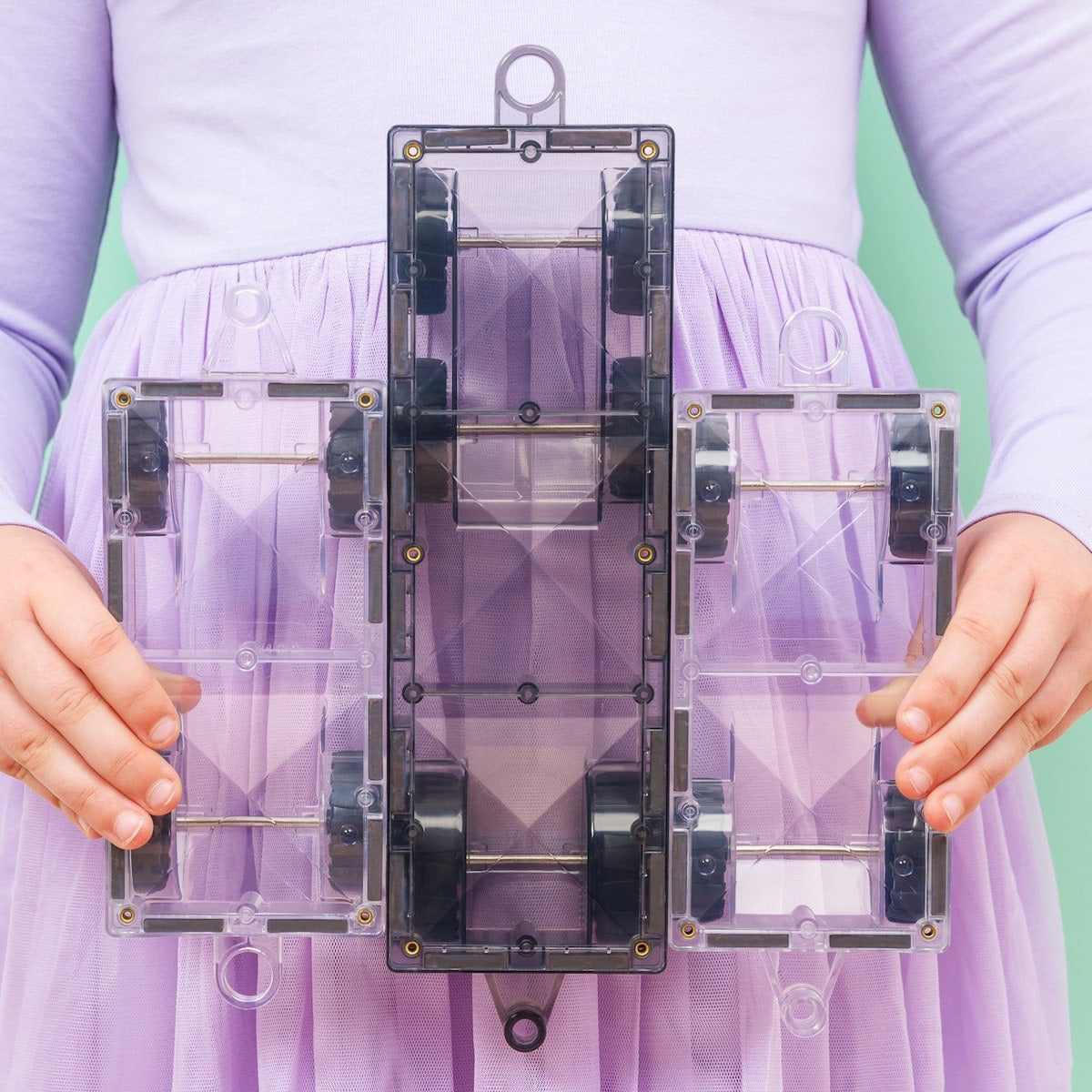 Children playing with Connetix Pastel Transport Pack – magnetic car and train pieces in action"