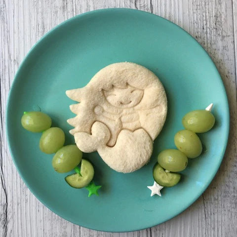 Lunch Punch Mermaid Cutter in use making a sandwich on plate