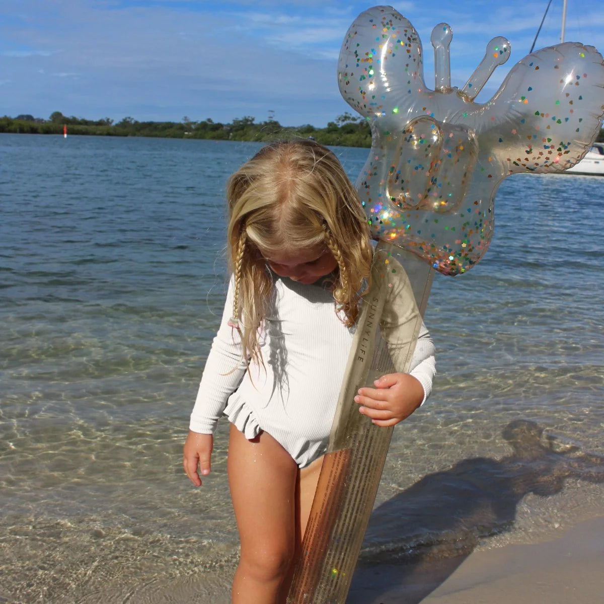 Children playing in the pool with Sunnylife Cotton Candy Glitter kids inflatable noodles