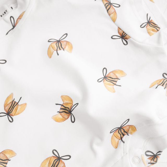 White shirt with croissant  pattern on a white background