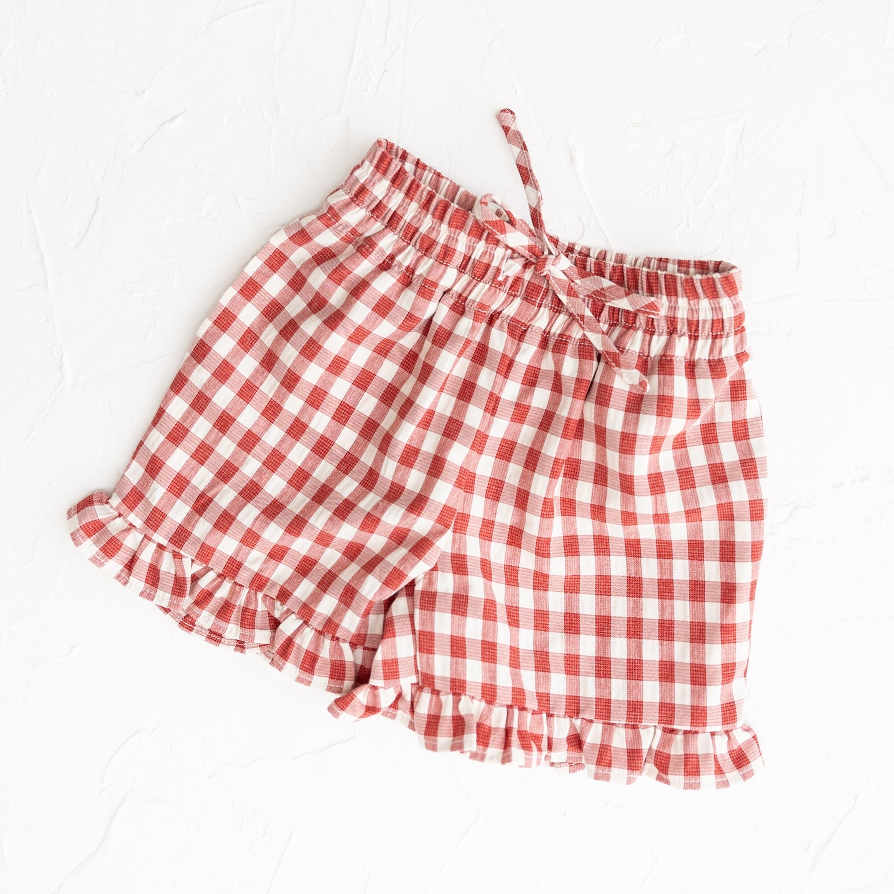 Red Gingham Ruffle Shorts by Cinnamon Baby for Merci colelction | Now at White Fox & Co
