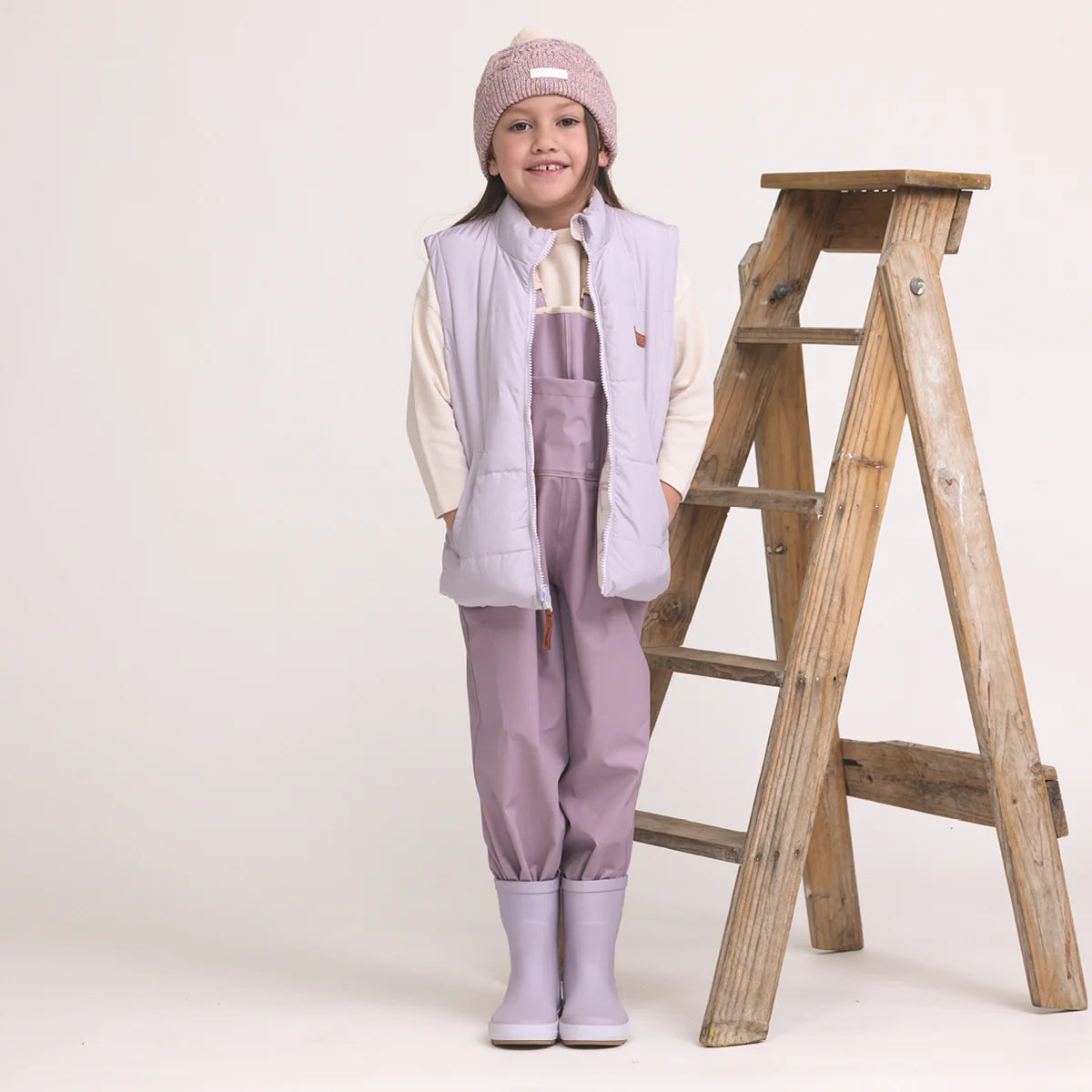 Child wearing Crywolf Rain Boots Heather outdoors