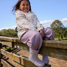Child wearing Crywolf Rain Boots Heather outdoors