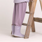 Child wearing Crywolf Rain Boots Heather outdoors