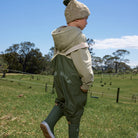 Child wearing Crywolf Rain Overalls Olive outdoors