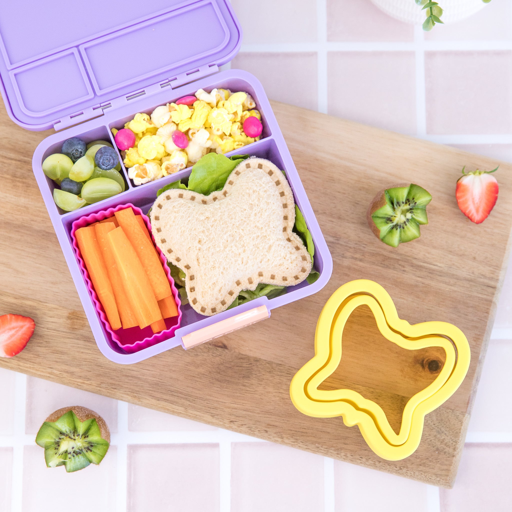 Inside view of MontiiCo Bento Three Dusk lunchbox showing three leakproof compartments
