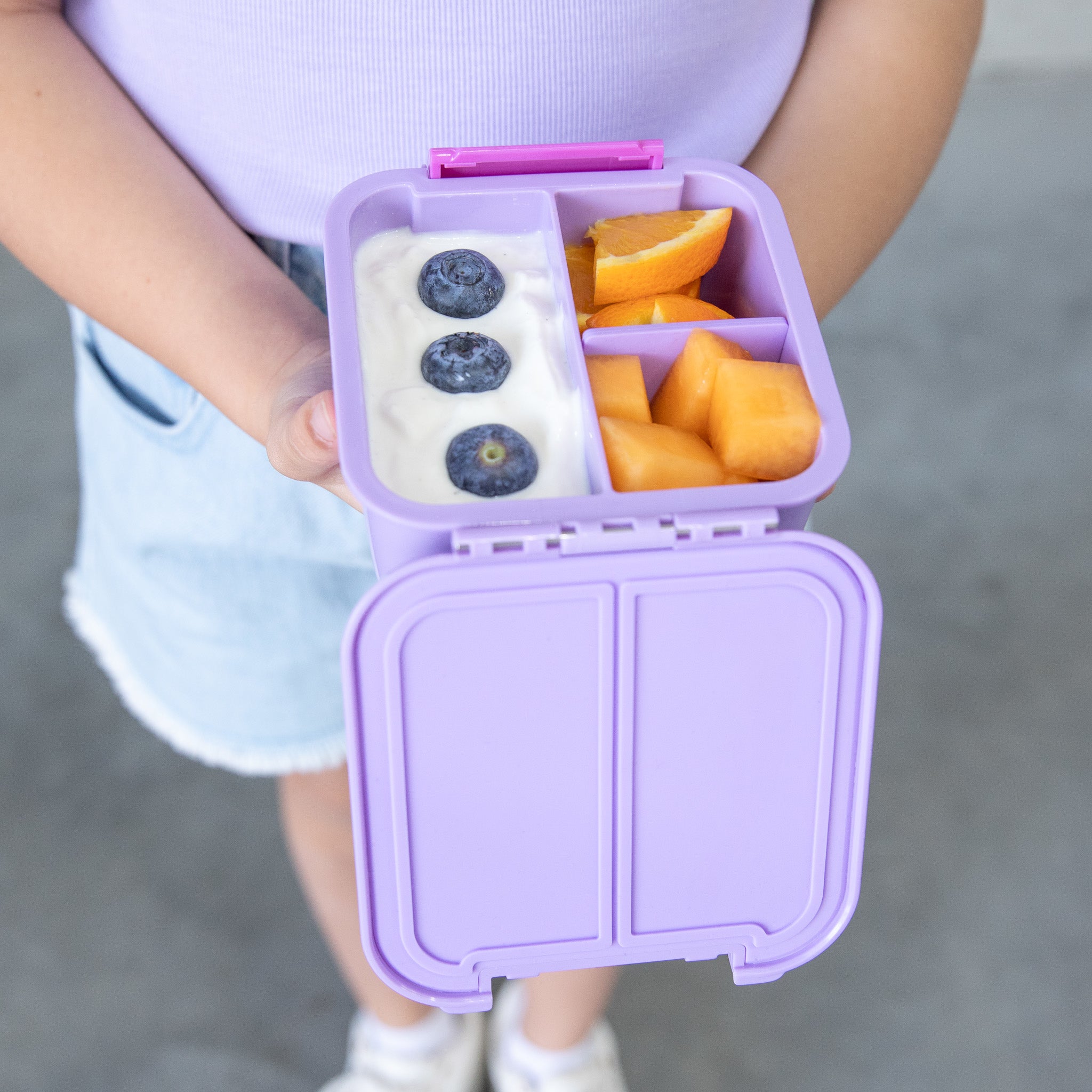 nside view of MontiiCo Bento Two Dusk lunchbox showing two leakproof compartments and removable divider