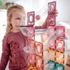 Children playing with Connetix pastel magnetic balls