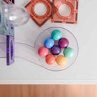 Close-up of pastel Connetix magnetic tiles and ball run tube components