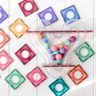 Close-up of pastel Connetix magnetic tiles and ball run tube components
