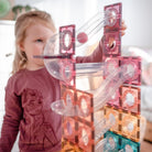 Children playing with the Connetix Pastel Ball Run magnetic tile set