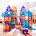 Children building structures with Connetix magnetic tiles