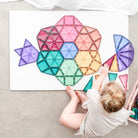 Children building a castle using Connetix Pastel Mega Pack magnetic tiles – stocked by White Fox & Co
