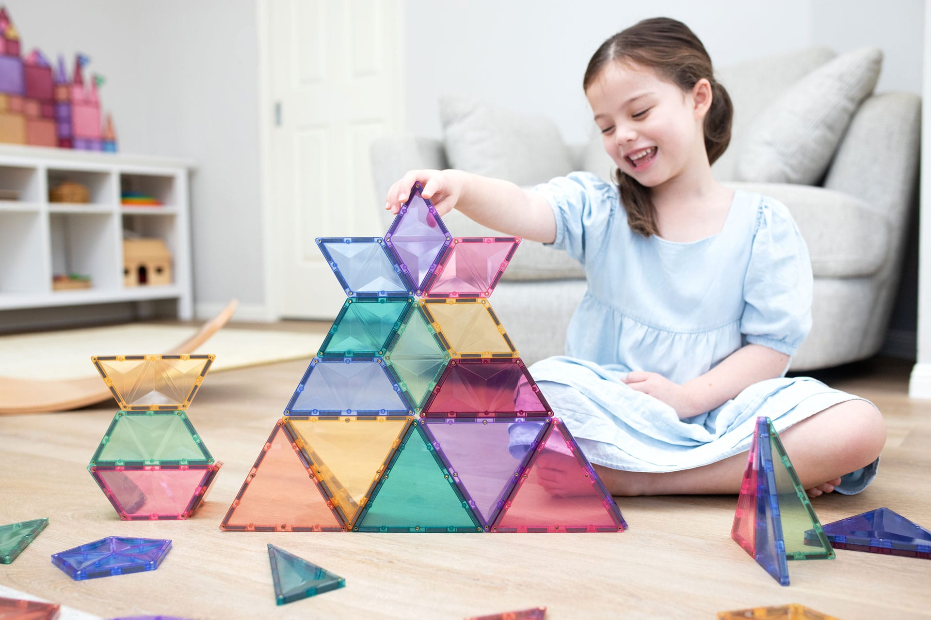 Children building creative 3D structures using Connetix Pastel Shape Expansion Pack