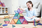 Children building creative 3D structures using Connetix Pastel Shape Expansion Pack