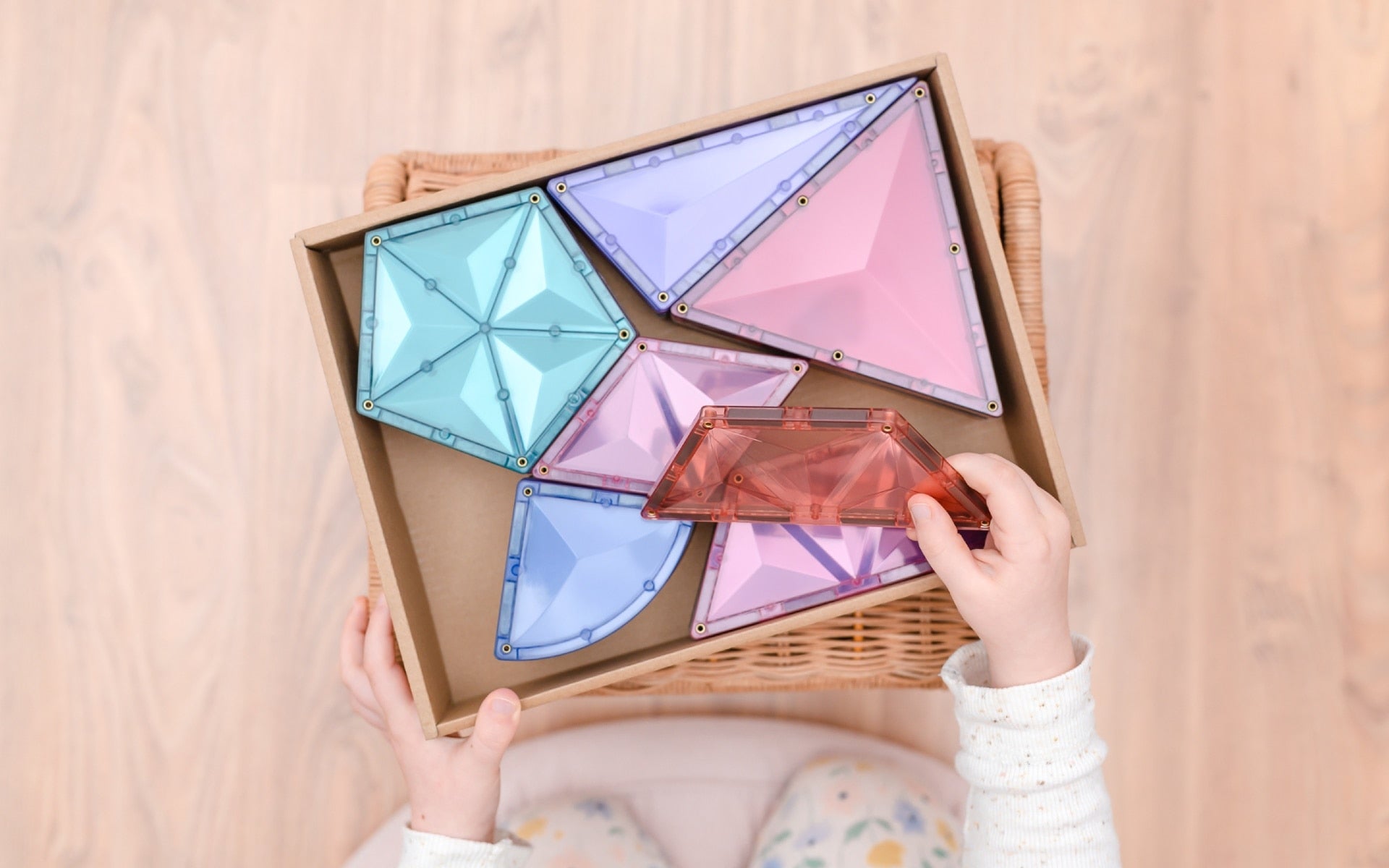Children building creative 3D structures using Connetix Pastel Shape Expansion Pack