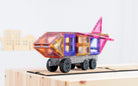 Children playing with Connetix Pastel Transport Pack – magnetic car and train pieces in action"