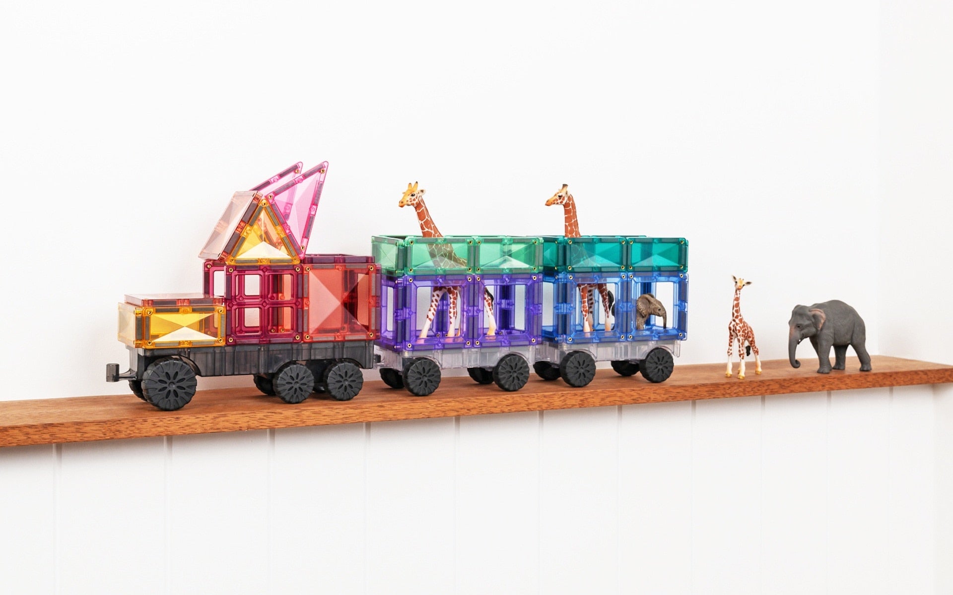 Close-up of pastel-coloured magnetic tiles and vehicle bases from Connetix Transport Pack