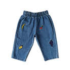 Grown organic cotton kids denim pants fruit embroidery detail