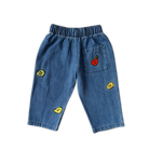 Grown organic cotton kids denim pants fruit embroidery detail