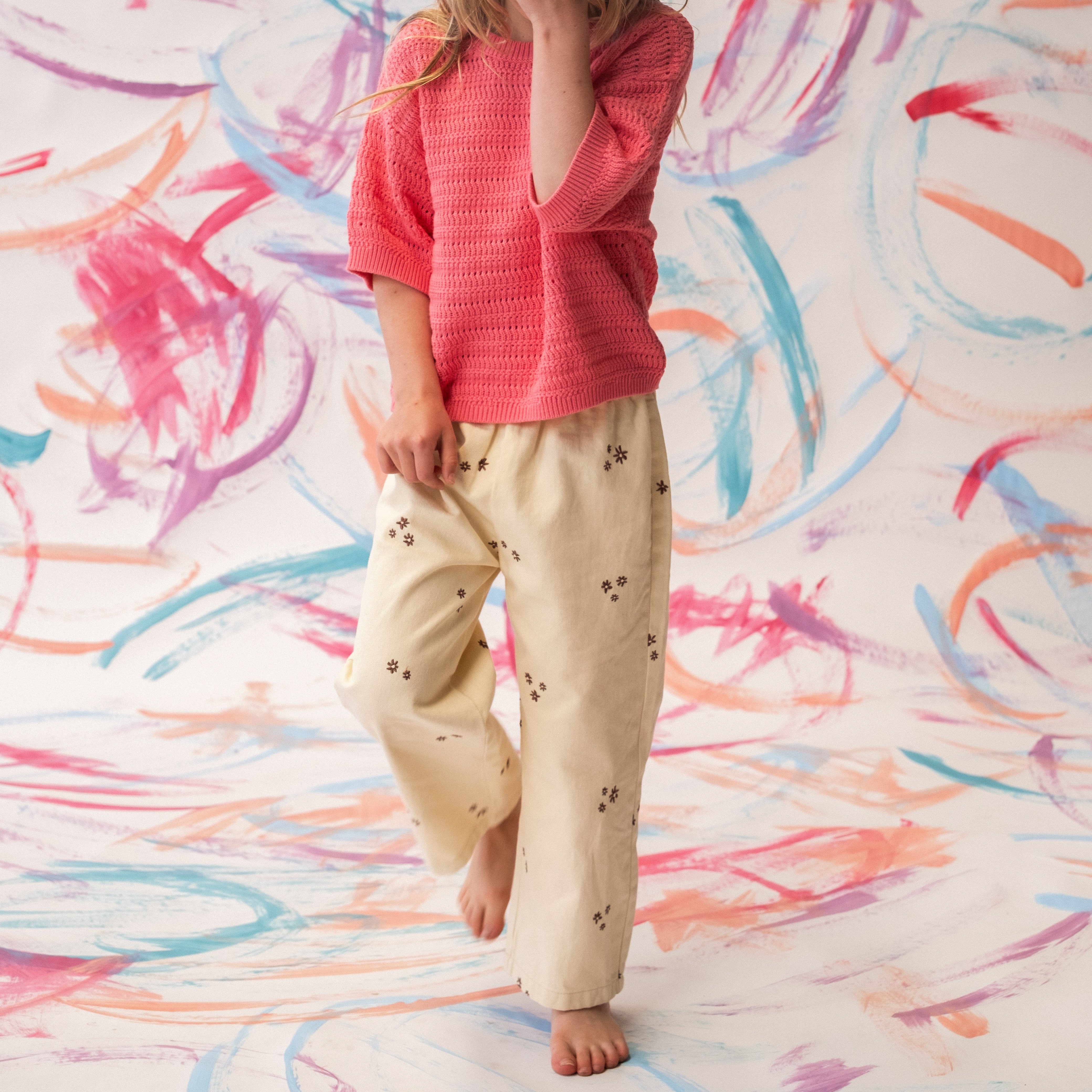 Close-up of wild flower embroidery detail on organic denim