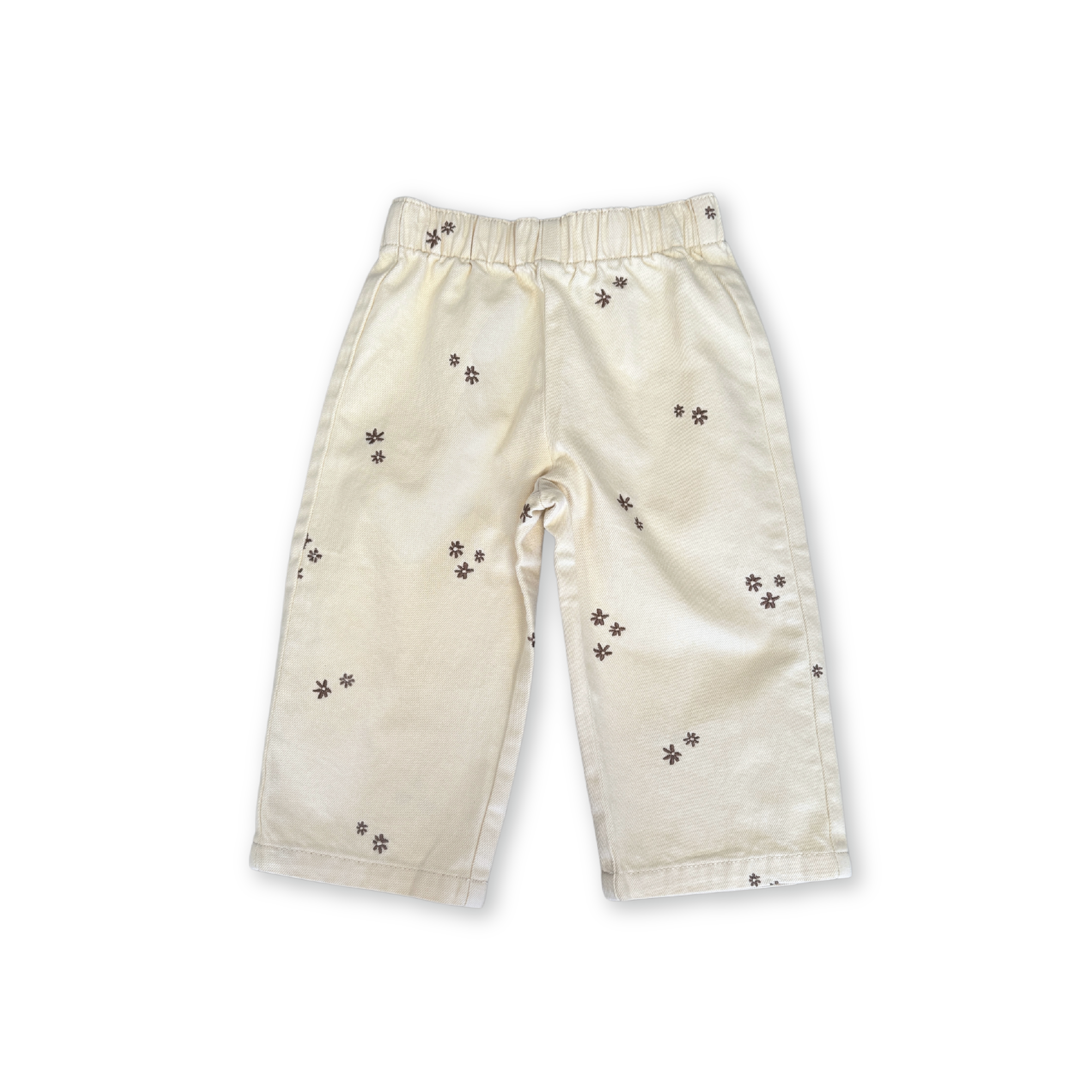 Organic denim pants in Milk with wild flower embroidery, front view