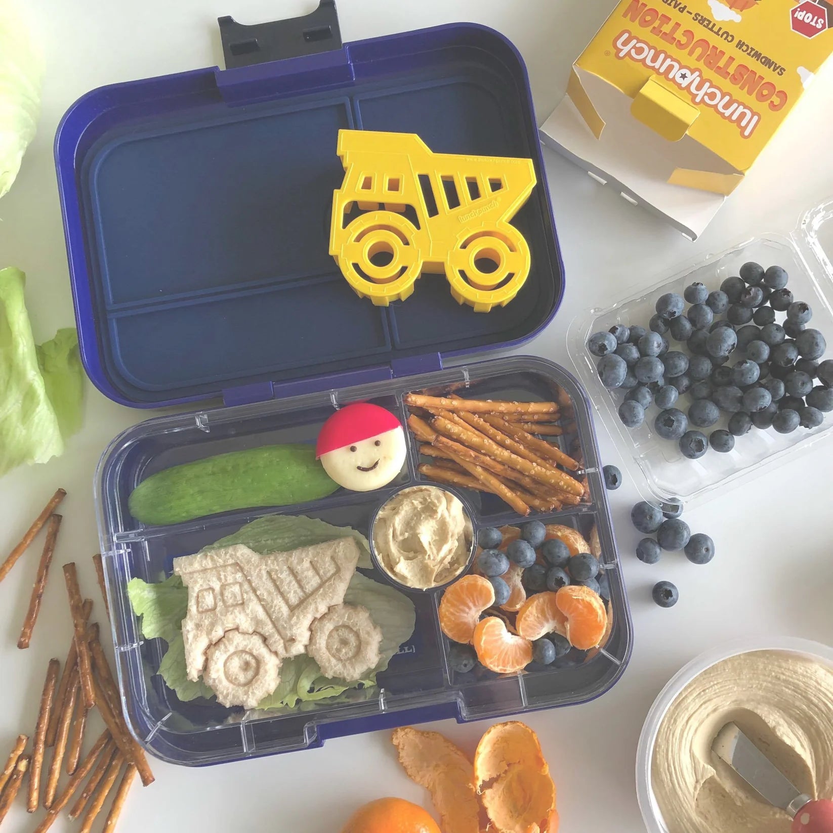 Construction-themed sandwiches made with Lunch Punch cutters on kids lunch box
