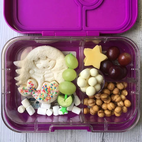 Lunch Punch Mermaid Cutter in use making a sandwich in purple lunchbox