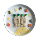 Styled lunch with sandwiches cut using Lunch Punch Space Set on dinner plate