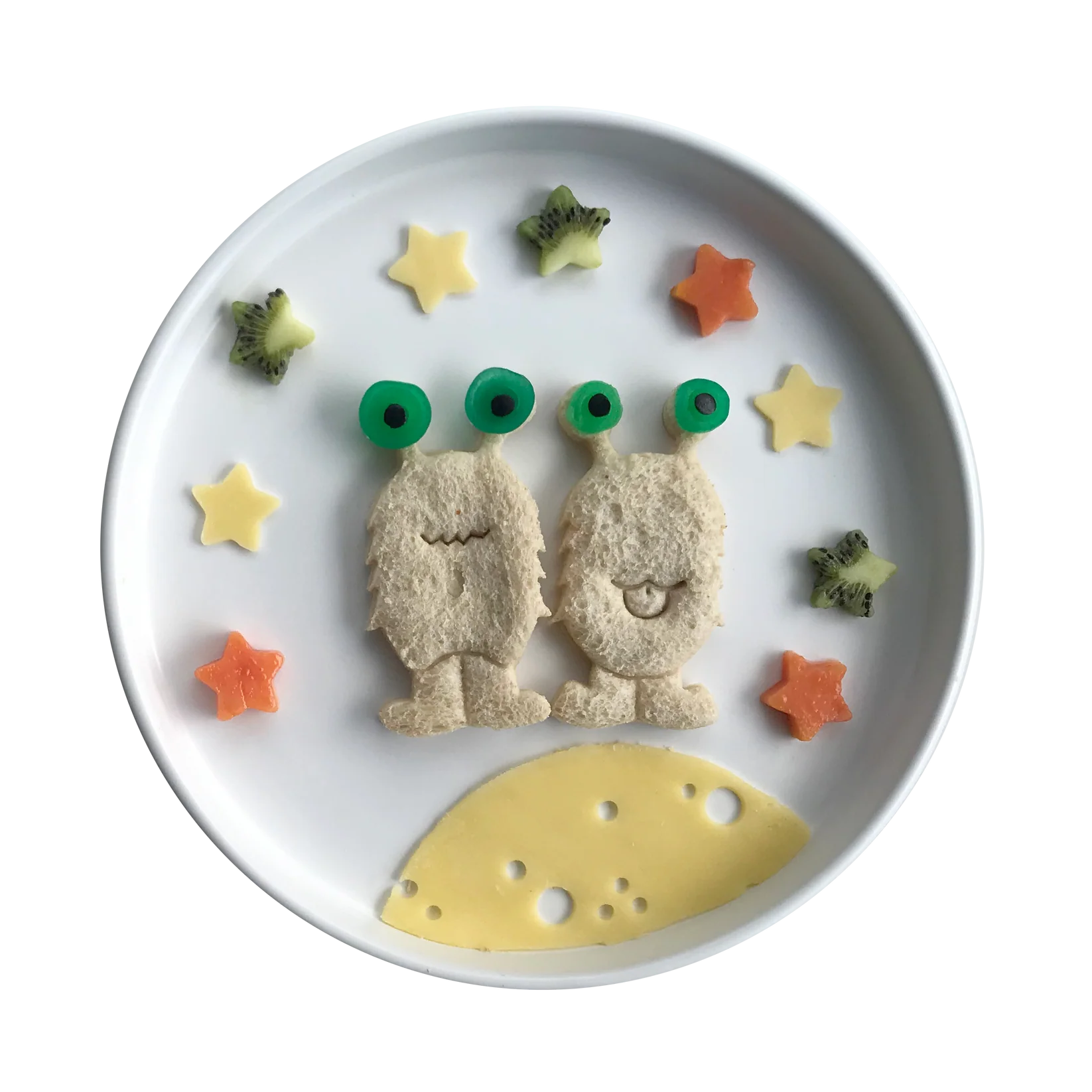 Styled lunch with sandwiches cut using Lunch Punch Space Set on dinner plate