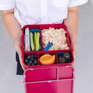 Reef blue silicone Bento Cups placed inside a MontiiCo lunchbox, separating food neatly
