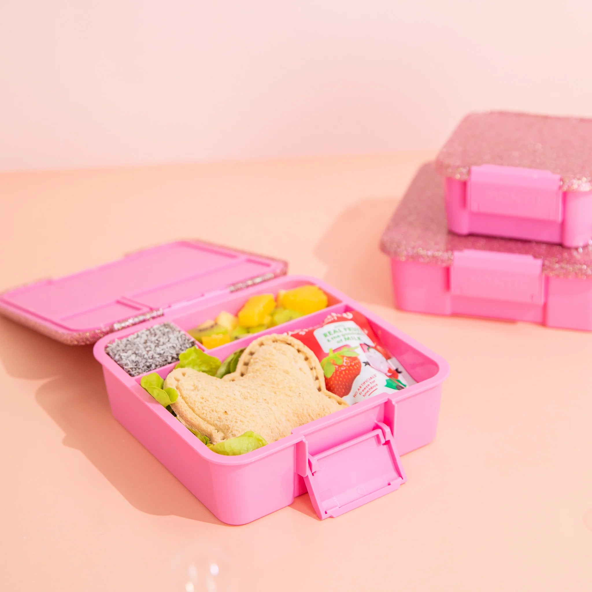 nside view of MontiiCo Bento Three Floss Glitter lunchbox showing leakproof compartments