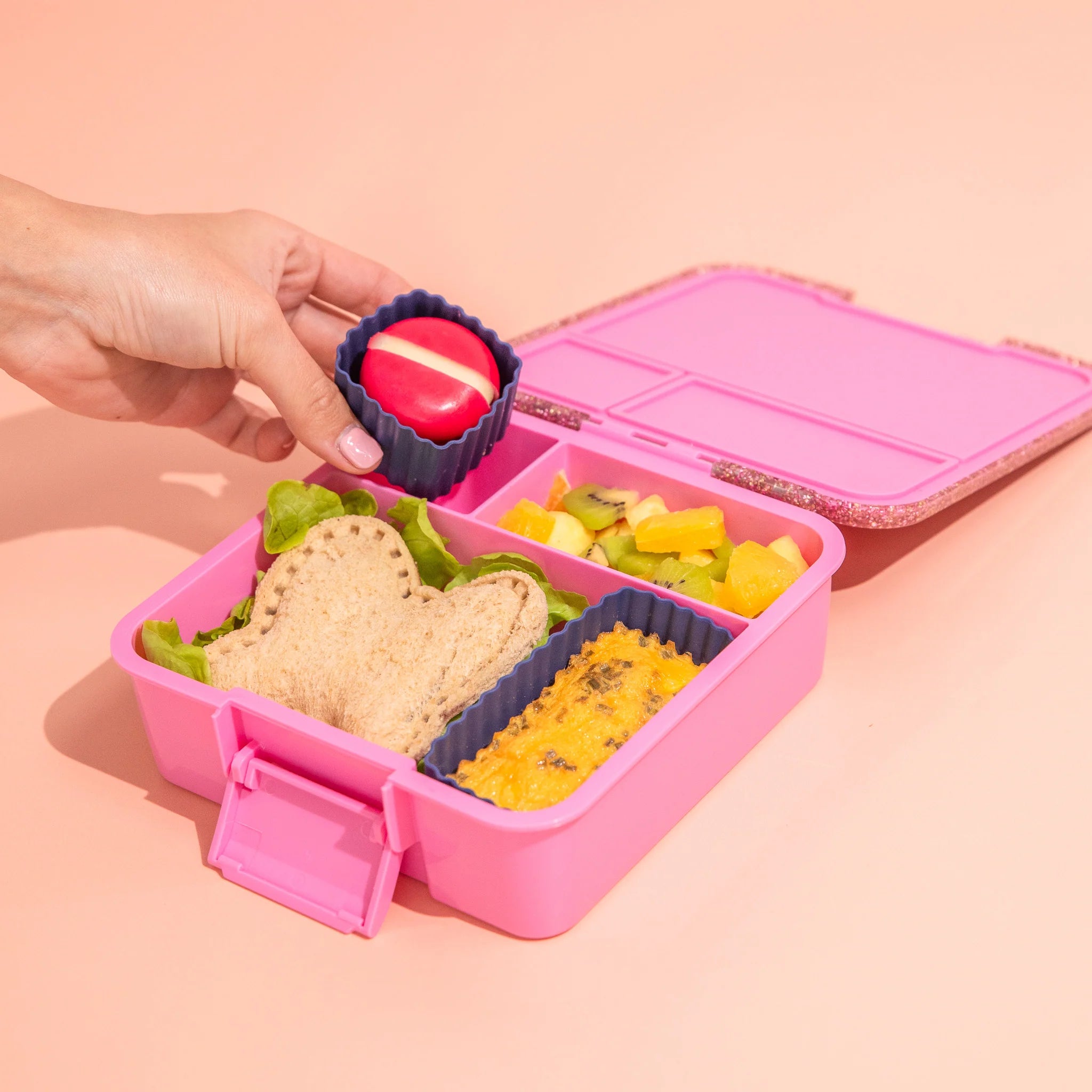 Inside view of MontiiCo Bento Three Floss Glitter lunchbox showing leakproof compartments