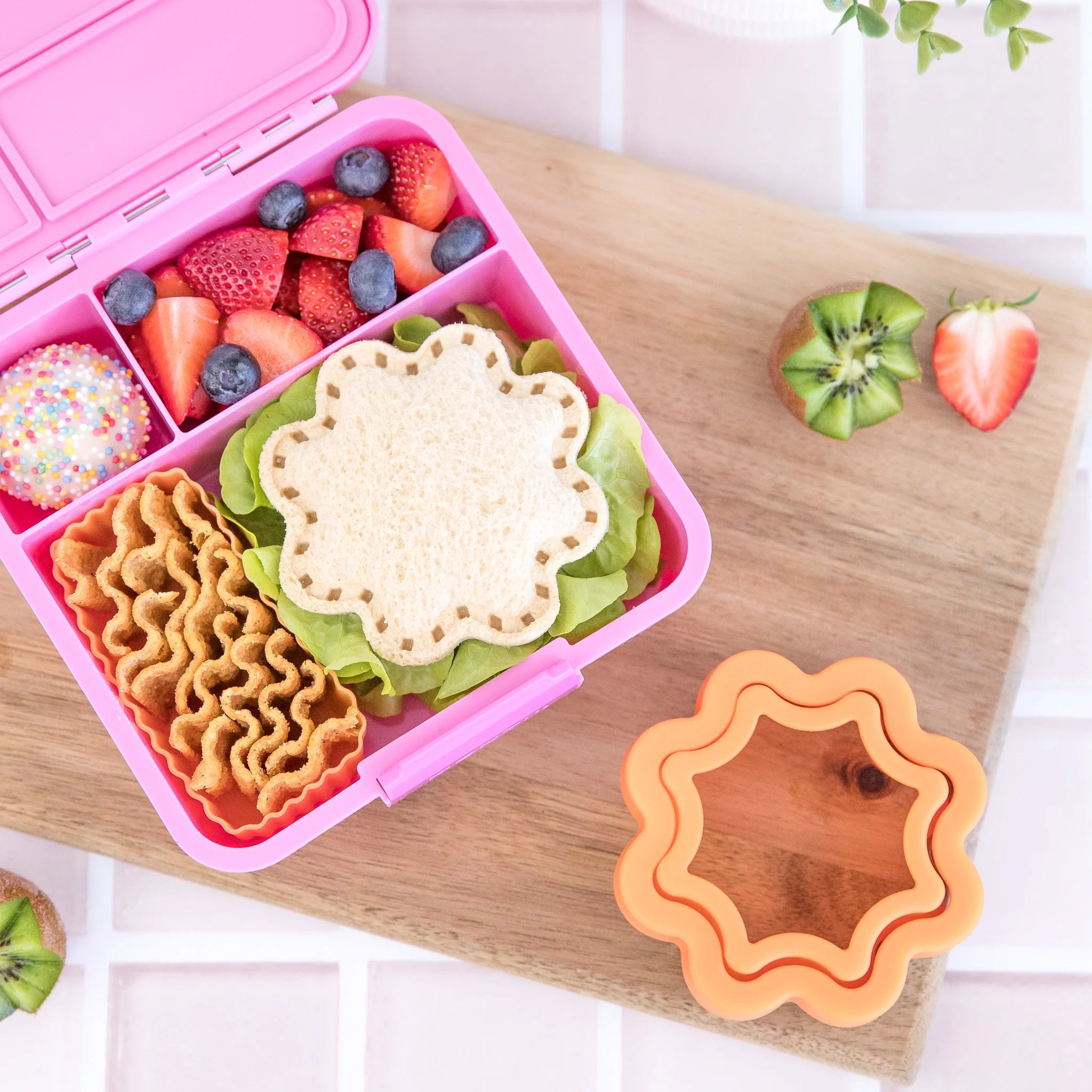 Inside view of MontiiCo Bento Three Floss lunchbox showing three leakproof compartments