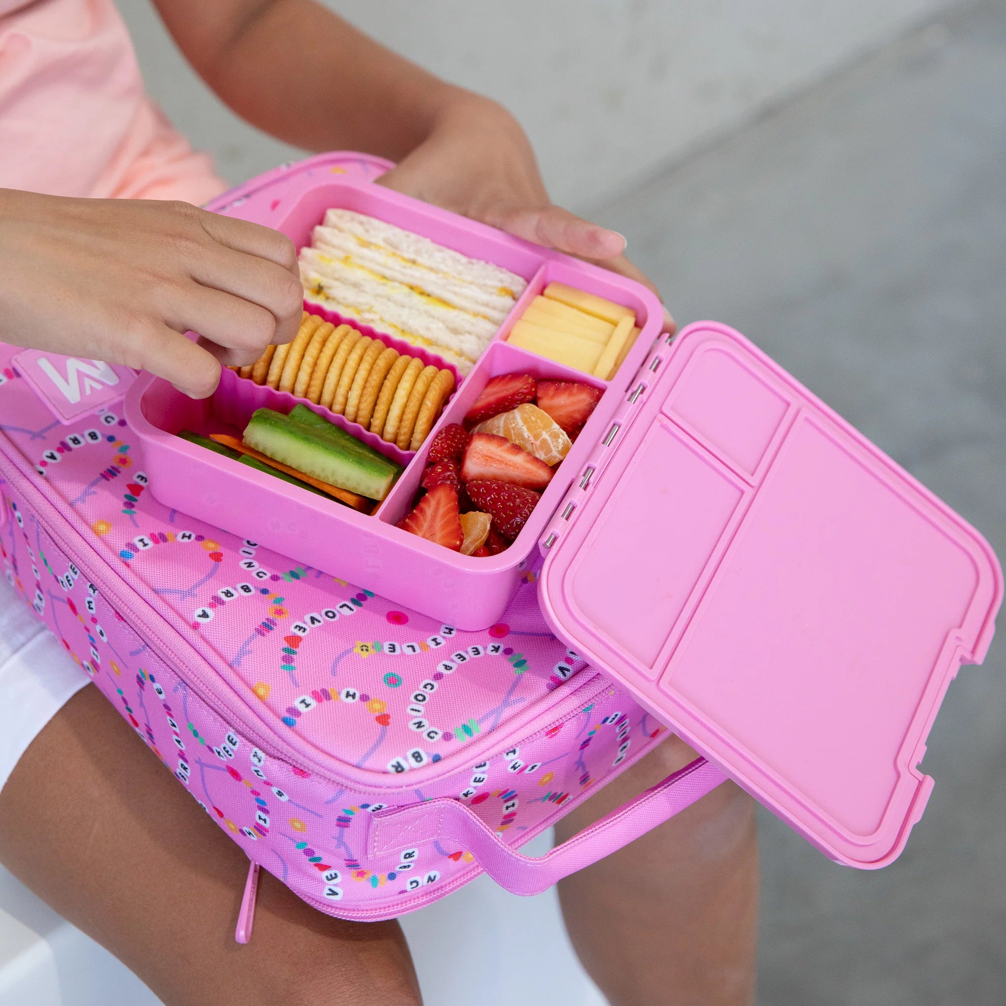 Inside view of MontiiCo Bento Three Floss lunchbox showing three leakproof compartments