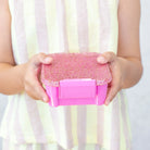 Child holding MontiiCo Bento Two in Floss Glitter – pink glitter lunchbox for school