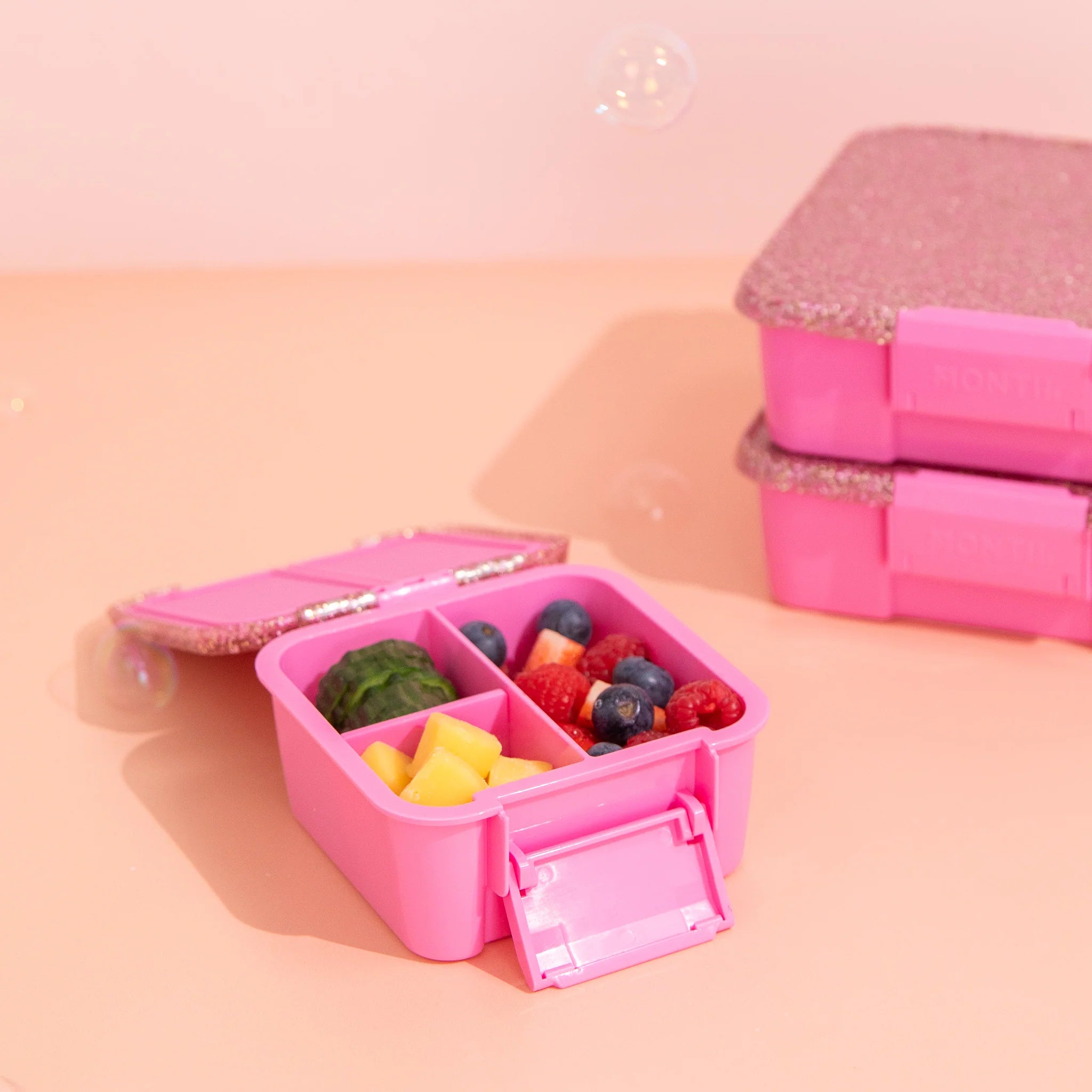 MontiiCo Bento Two Floss Glitter lunchbox open showing leakproof compartments and removable divider