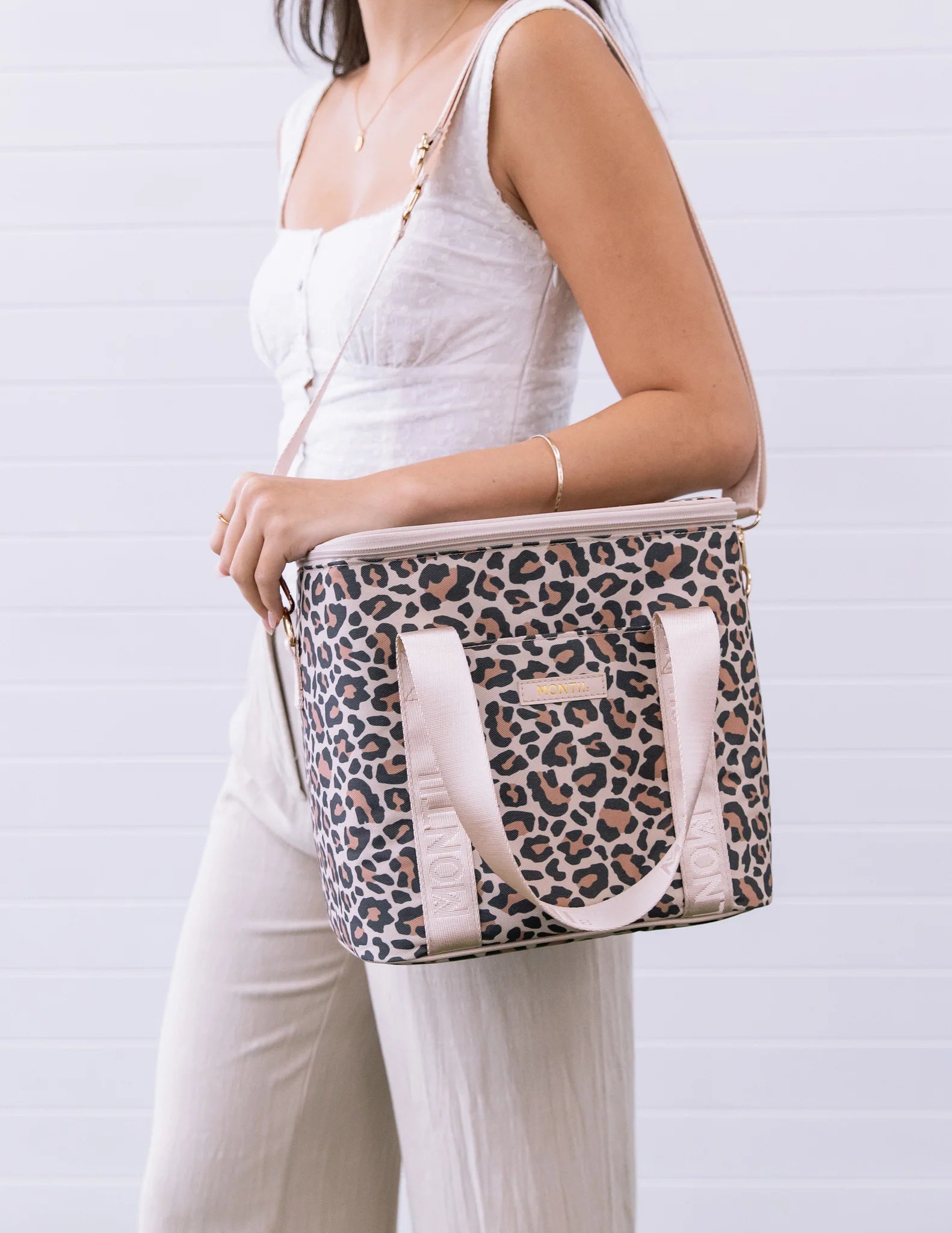 MontiiCo Safari Midi Cooler Bag showing front pocket and gold hardware details