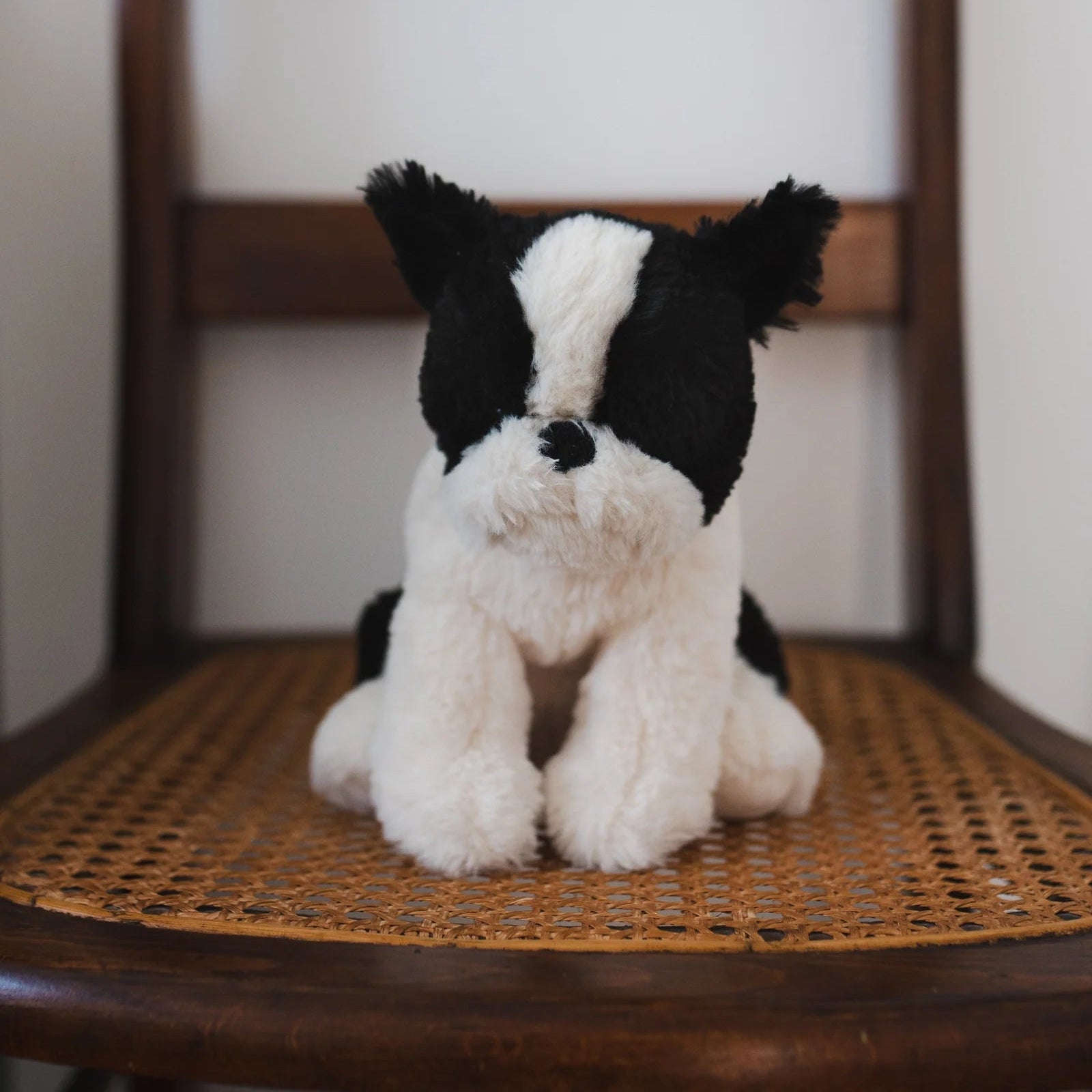 Bruce the Bulldog plush toy by Nana Huchy, black and white soft toy 30cm on chair