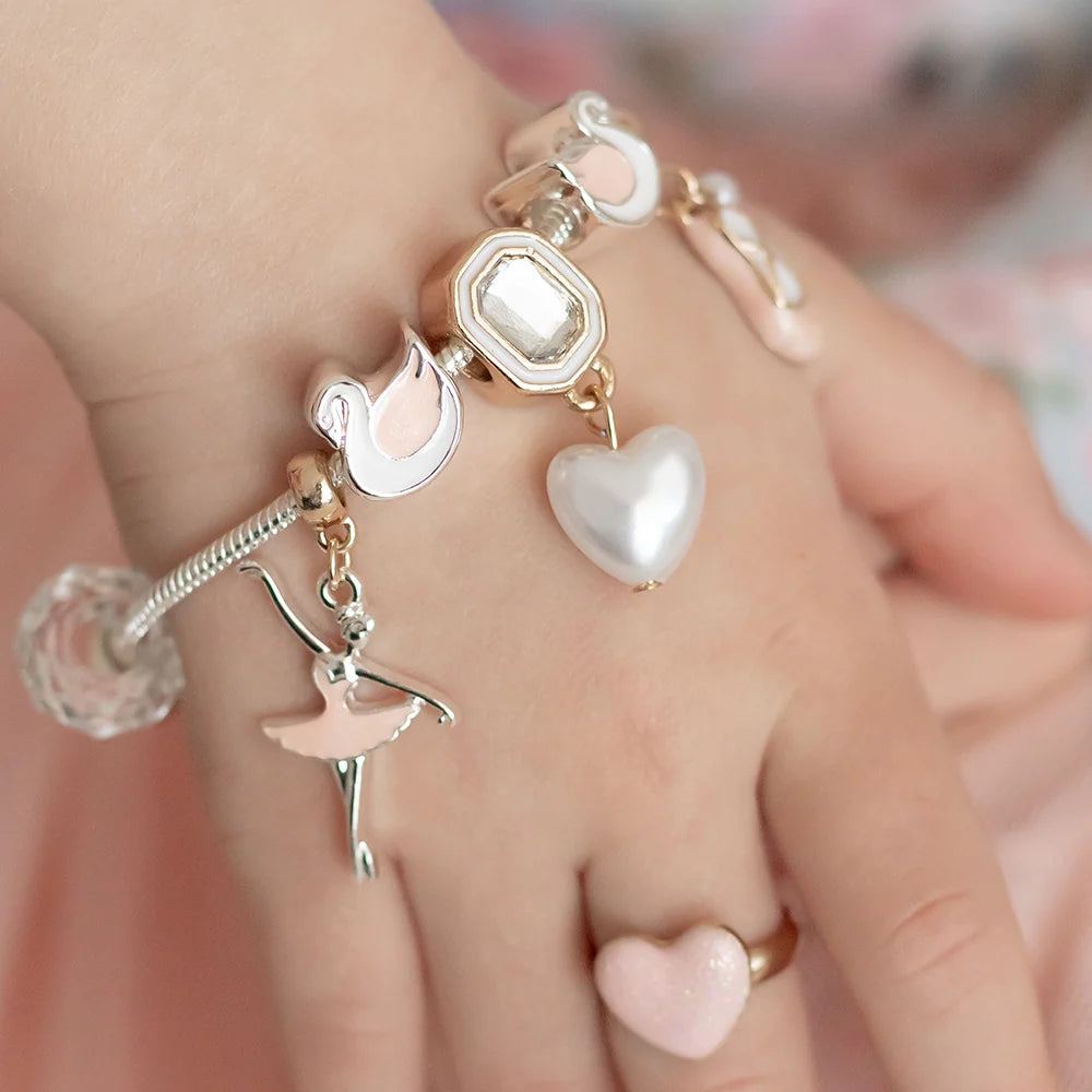 Lauren Hinkley Swan Lake Charm Bracelet featuring Princess Odette, two swan maidens, and a pearl-like heart charm – children’s jewellery gift